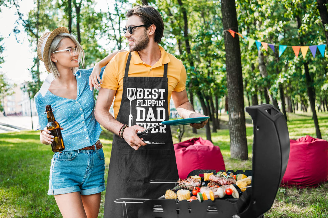 VAGAVY - Best Flippin Dad Ever Dad Apron with Pockets - Bottle Opener and Gift Box Included - Birthday, Father’s Day Grilling Gifts for Papa, Husband - Black Barbeque Apron for Daddy Men - Grill Parts America
